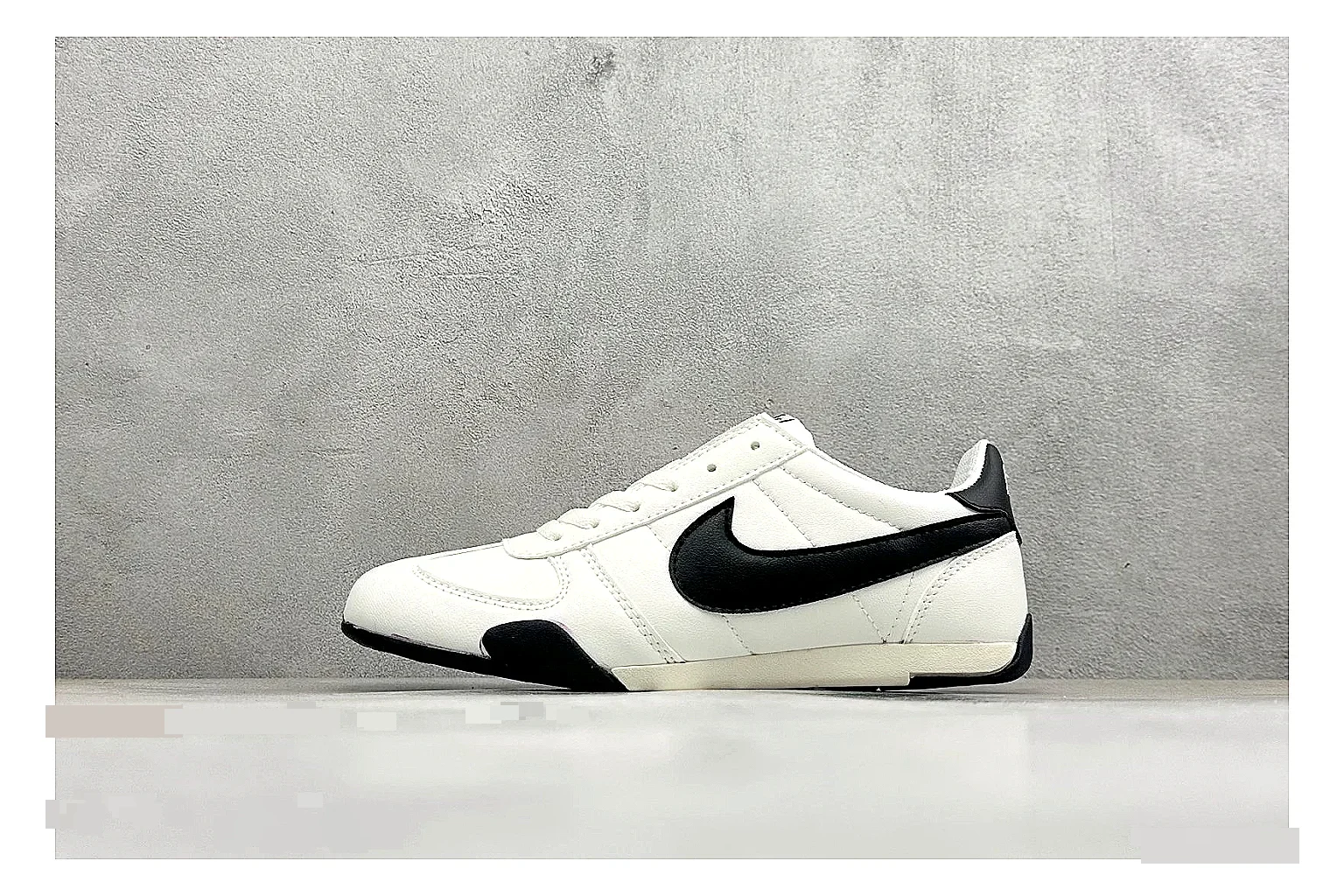Nike Sprint Sister White Black spreadsheet record photo showing white retro-runner upper, black Swoosh contrast, slim low-top profile, and light casual sole