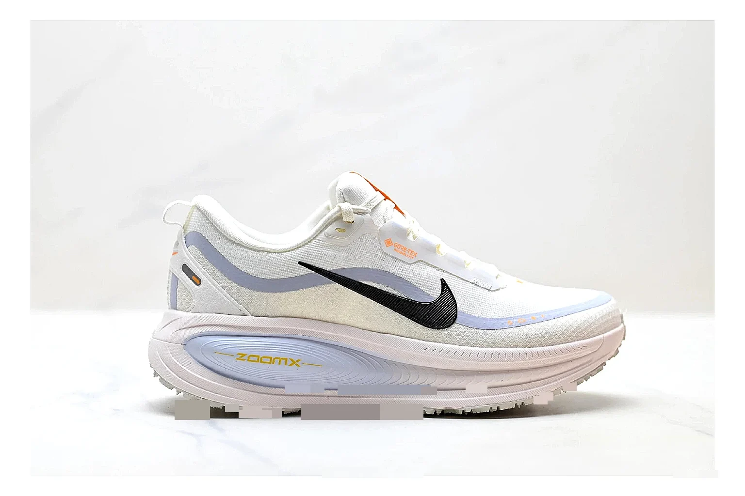Nike Vomero White Orange spreadsheet record photo showing white mesh runner upper, orange accents, layered Vomero-style panels, and cushioned modern sole