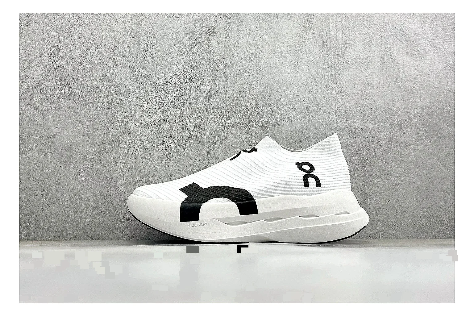 On Cloudboom White Black spreadsheet record photo showing white performance mesh, black contrast details, slim racing profile, and segmented CloudTec sole