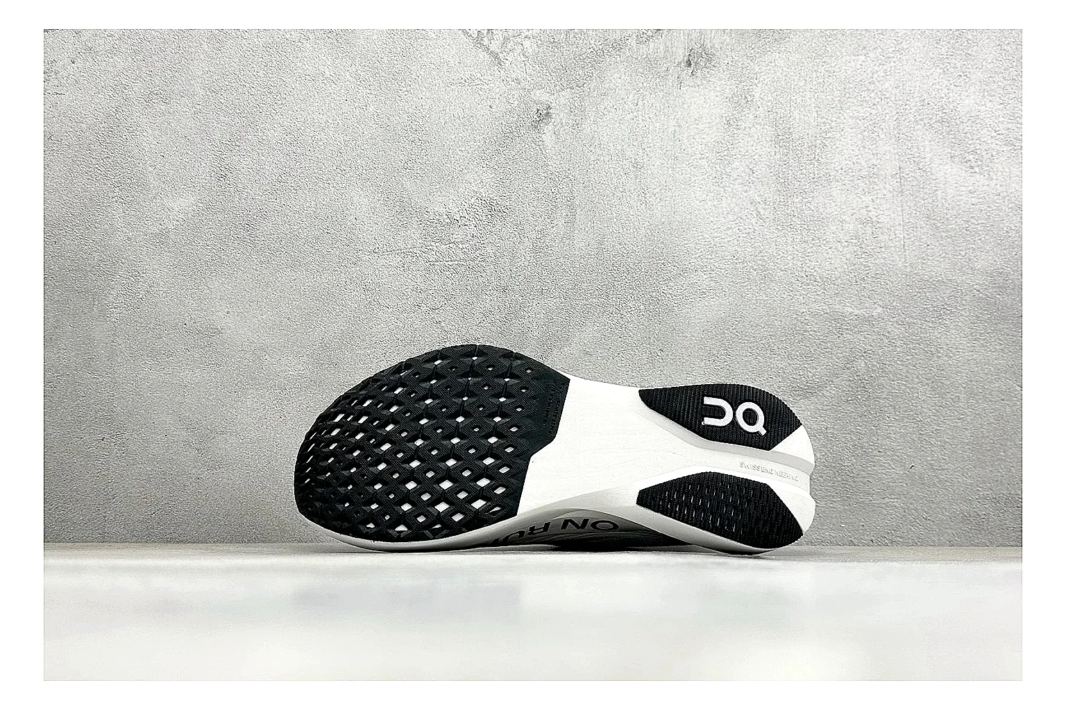 On Cloudboom White Black spreadsheet record photo showing white performance mesh, black contrast details, slim racing profile, and segmented CloudTec sole