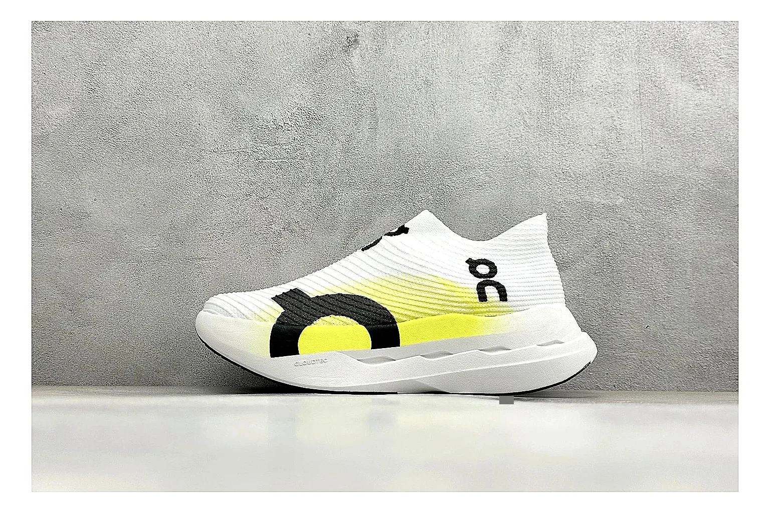 On Cloudboom White Lime spreadsheet record photo showing white performance mesh, lime gradient accents, slim racing profile, and segmented CloudTec sole