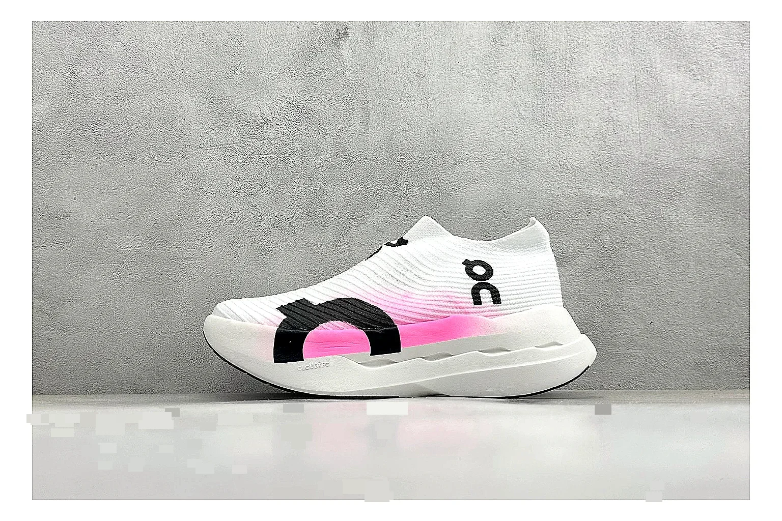 On Cloudboom White Pink spreadsheet record photo showing white running mesh, pink gradient accents, low racing shape, and segmented CloudTec sole