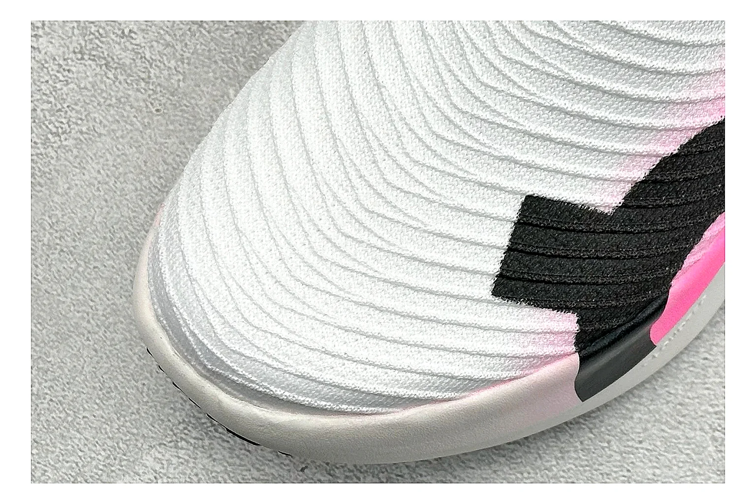 On Cloudboom White Pink spreadsheet record photo showing white running mesh, pink gradient accents, low racing shape, and segmented CloudTec sole thumbnail 5