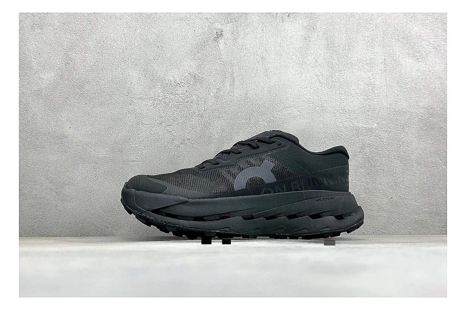 On Cloudmonster Triple Black spreadsheet record photo showing triple black mesh upper, oversized CloudTec sole pods, tonal laces, and rounded runner shape