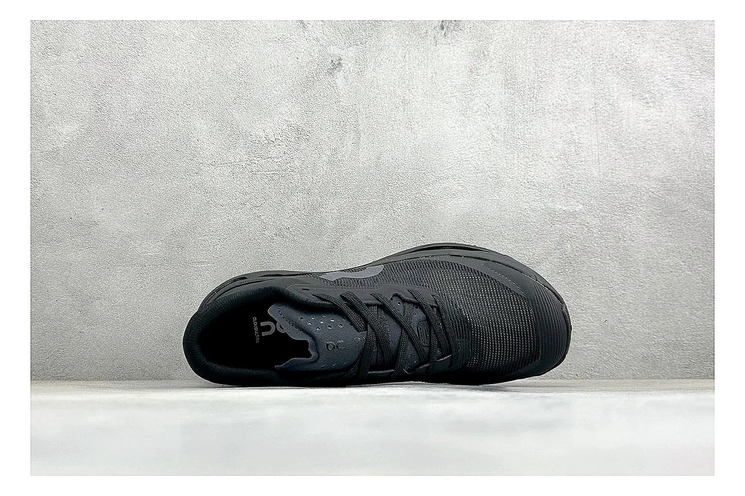 On Cloudmonster Triple Black spreadsheet record photo showing triple black mesh upper, oversized CloudTec sole pods, tonal laces, and rounded runner shape thumbnail 2