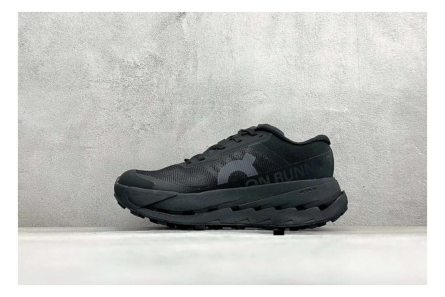 On Cloudmonster Triple Black spreadsheet record photo showing triple black running upper, oversized CloudTec pod sole, tonal laces, and rounded performance shape