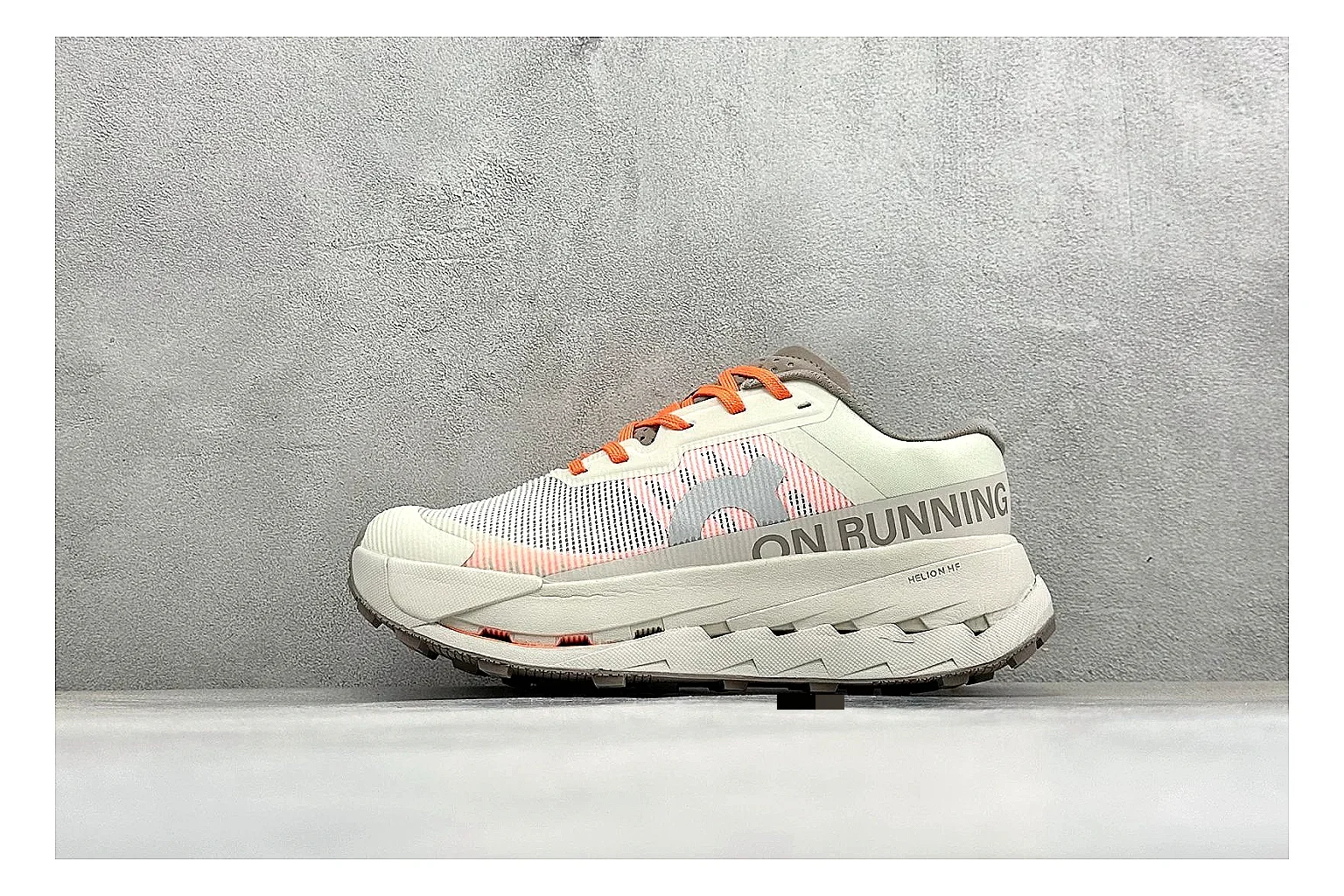 On Cloudmonster White Orange spreadsheet record photo showing white running mesh, orange accent hits, oversized CloudTec sole pods, and a rounded runner silhouette