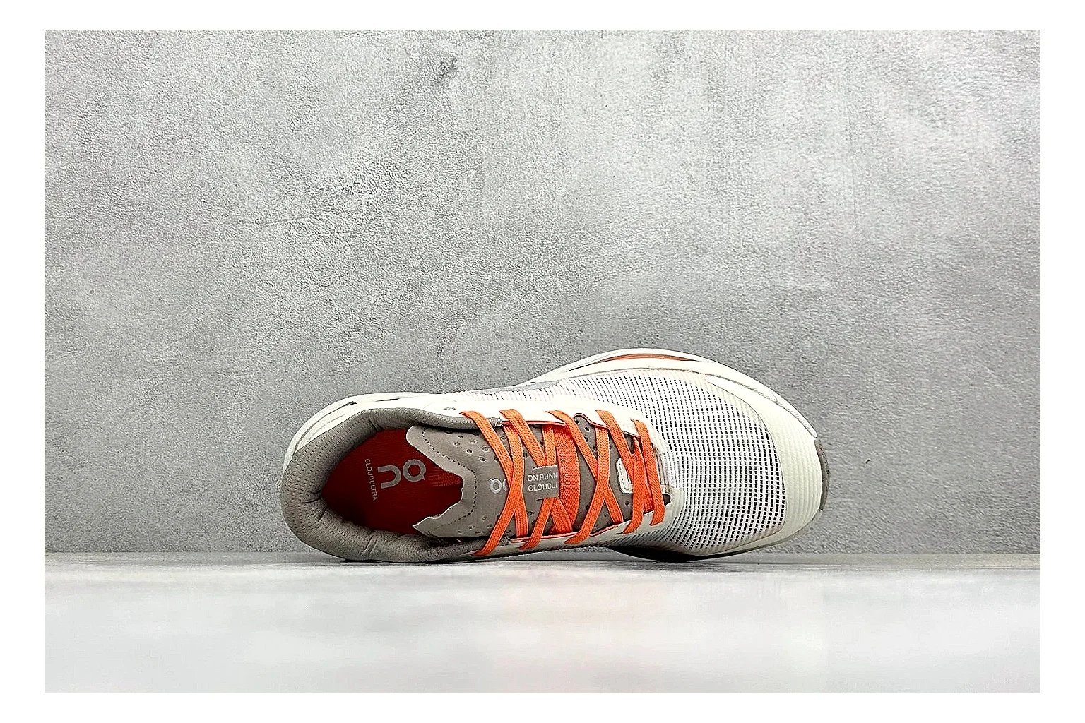 On Cloudmonster White Orange spreadsheet record photo showing white running mesh, orange accent hits, oversized CloudTec sole pods, and a rounded runner silhouette thumbnail 2