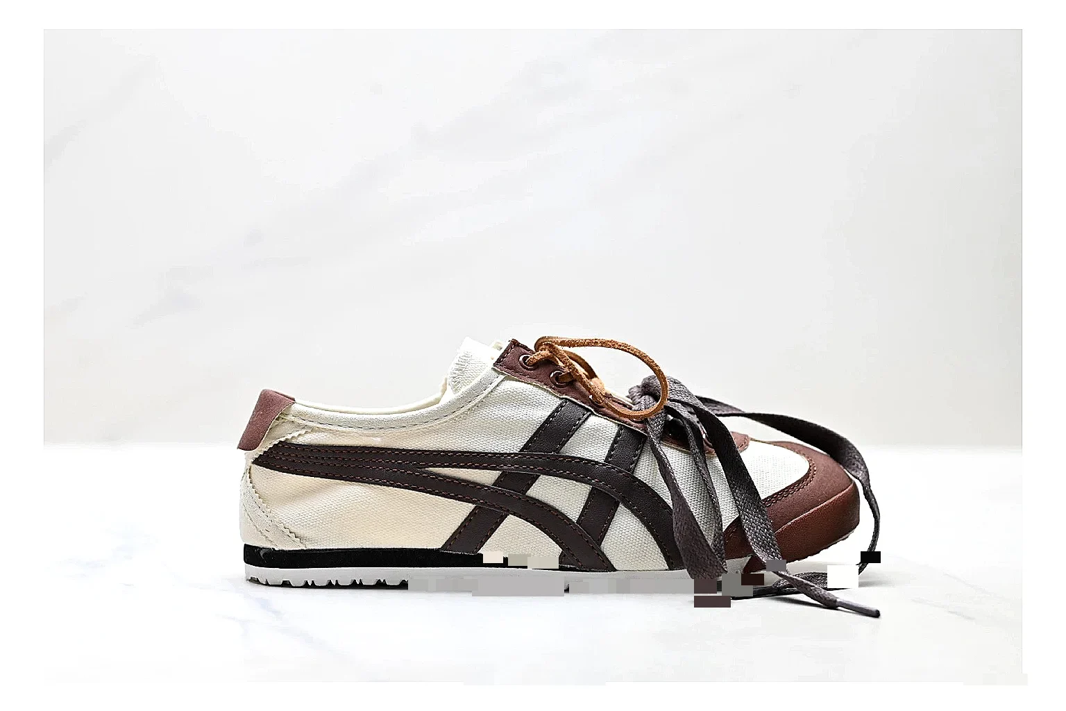 Onitsuka Tiger Mexico 66 Brown Cream Sneakers spreadsheet record image with brown cream low-top sneakers with leather texture, side-profile shape, upper panel lines, and outsole detail