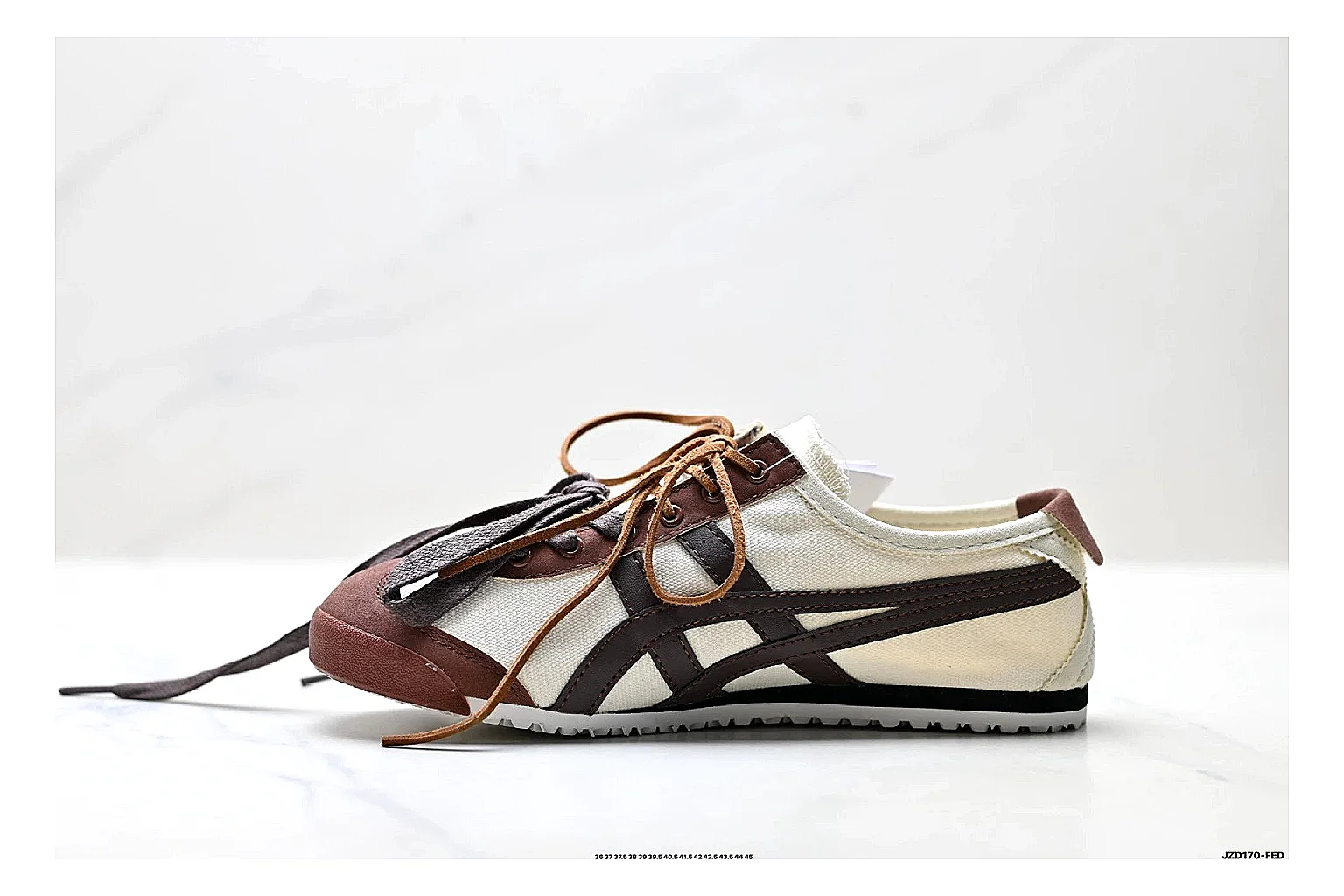 Onitsuka Tiger Mexico 66 Brown Cream Sneakers spreadsheet record image with brown cream low-top sneakers with leather texture, side-profile shape, upper panel lines, and outsole detail thumbnail 6