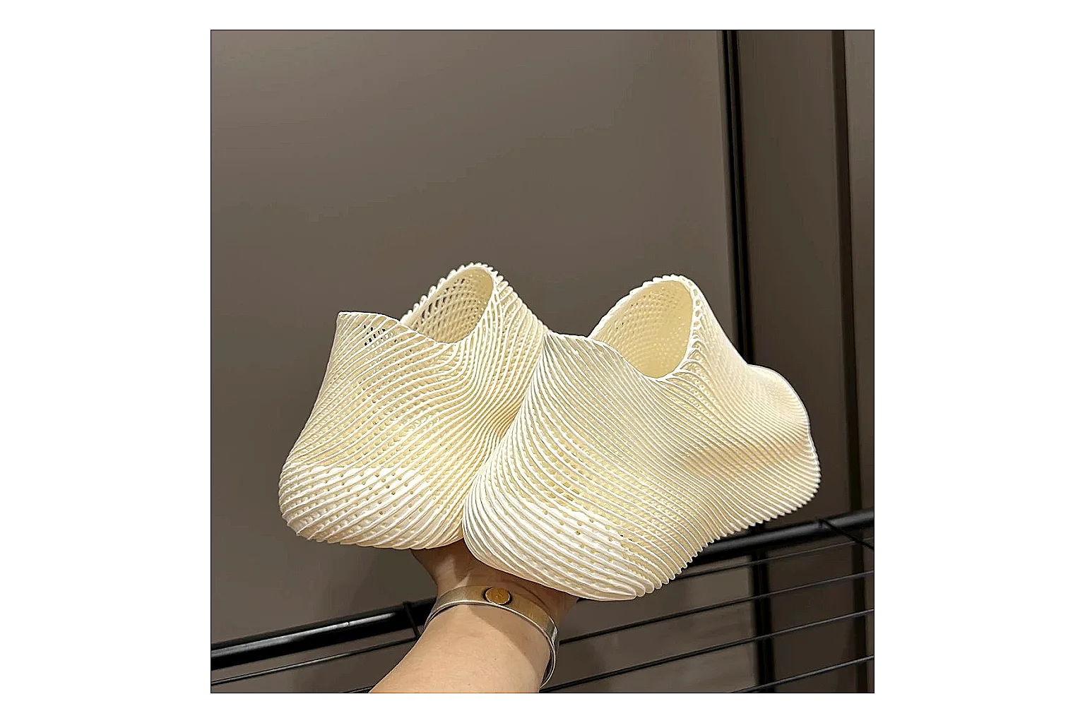 Other 4D Printed Cream Slip-On Sneakers spreadsheet record photo showing cream open-grid upper, seamless slip-on profile, sculpted sole, and soft futuristic casual shape