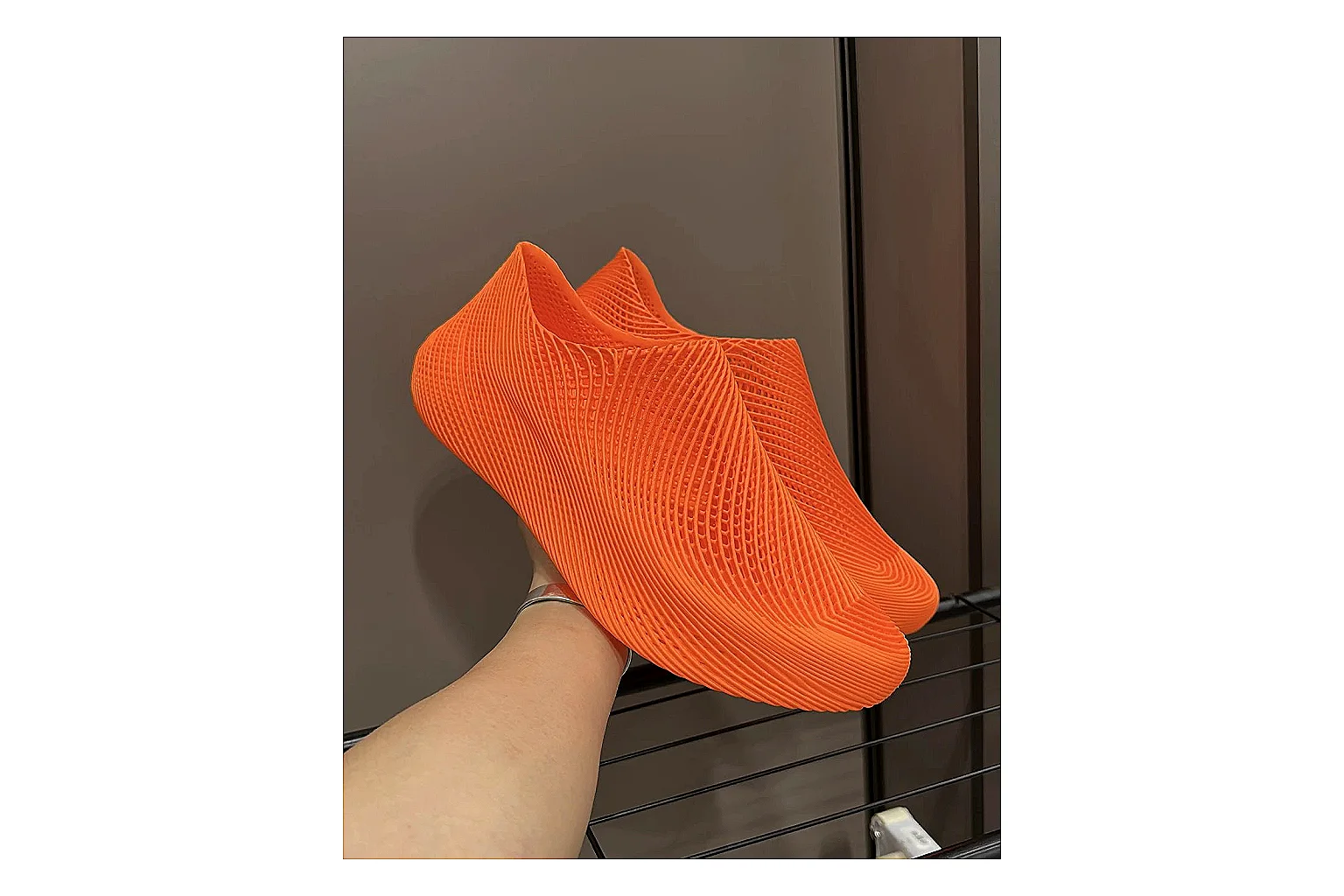Other 4D Printed Orange Slip-On Sneakers spreadsheet record photo showing orange open-grid upper, seamless slip-on shape, sculpted sole, and futuristic lightweight profile thumbnail 2