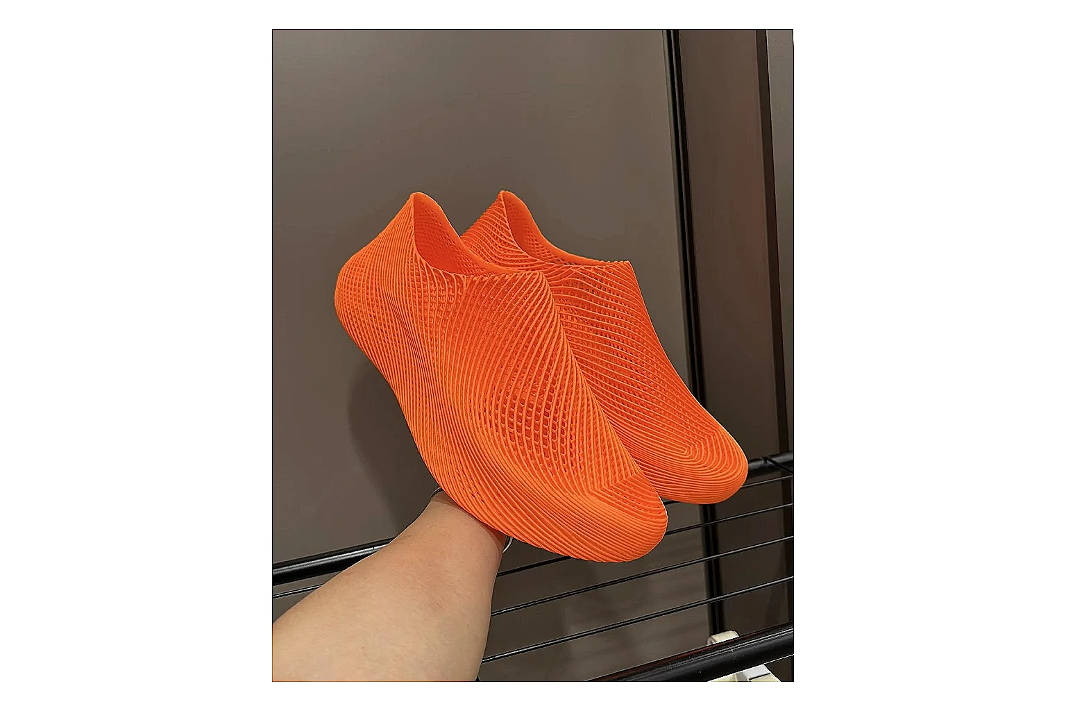 Other 4D Printed Orange Slip-On Sneakers spreadsheet record photo showing orange open-grid upper, seamless slip-on shape, sculpted sole, and futuristic lightweight profile thumbnail 3
