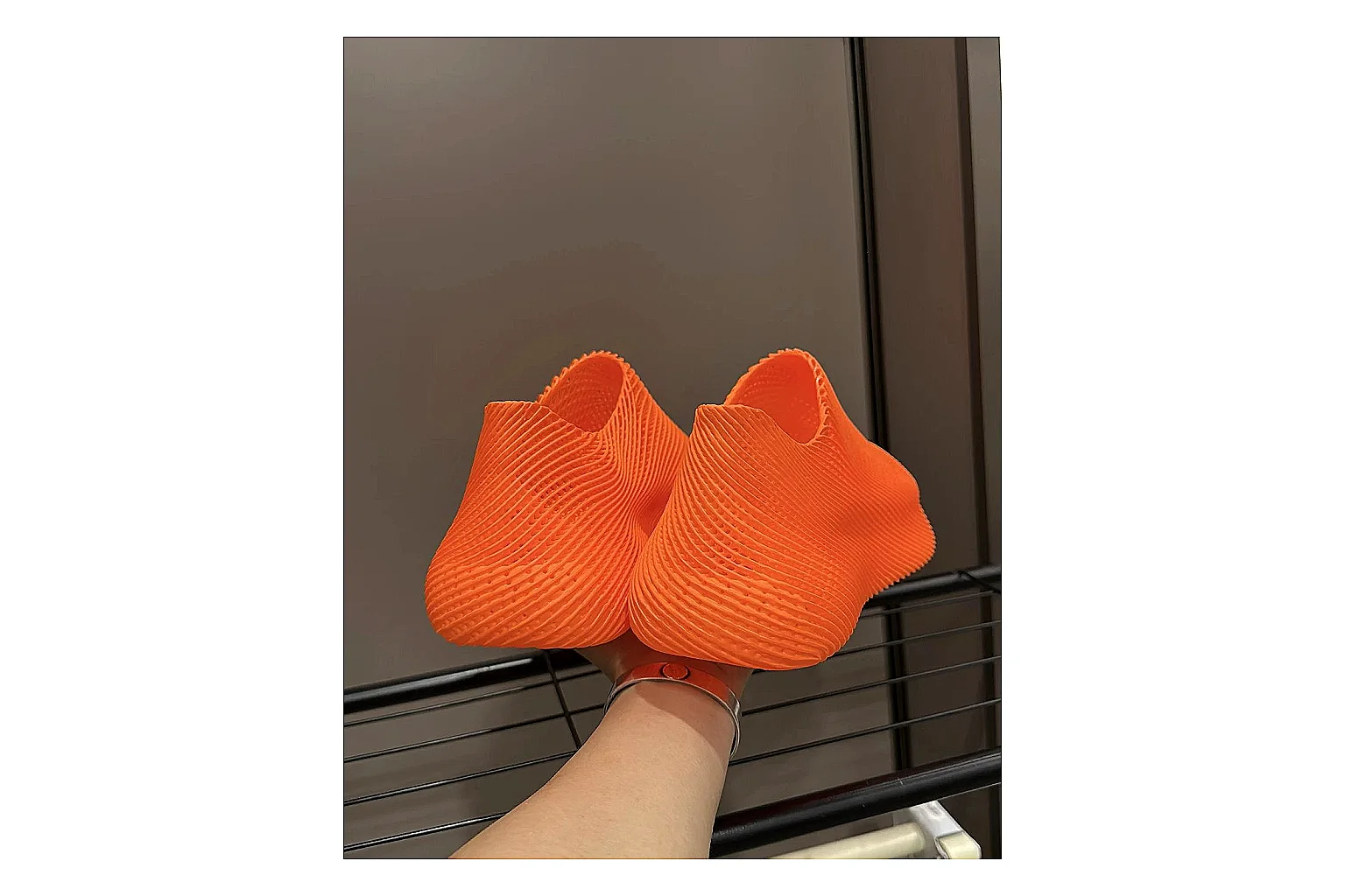 Other 4D Printed Orange Slip-On Sneakers spreadsheet record photo showing orange open-grid upper, seamless slip-on shape, sculpted sole, and futuristic lightweight profile thumbnail 4
