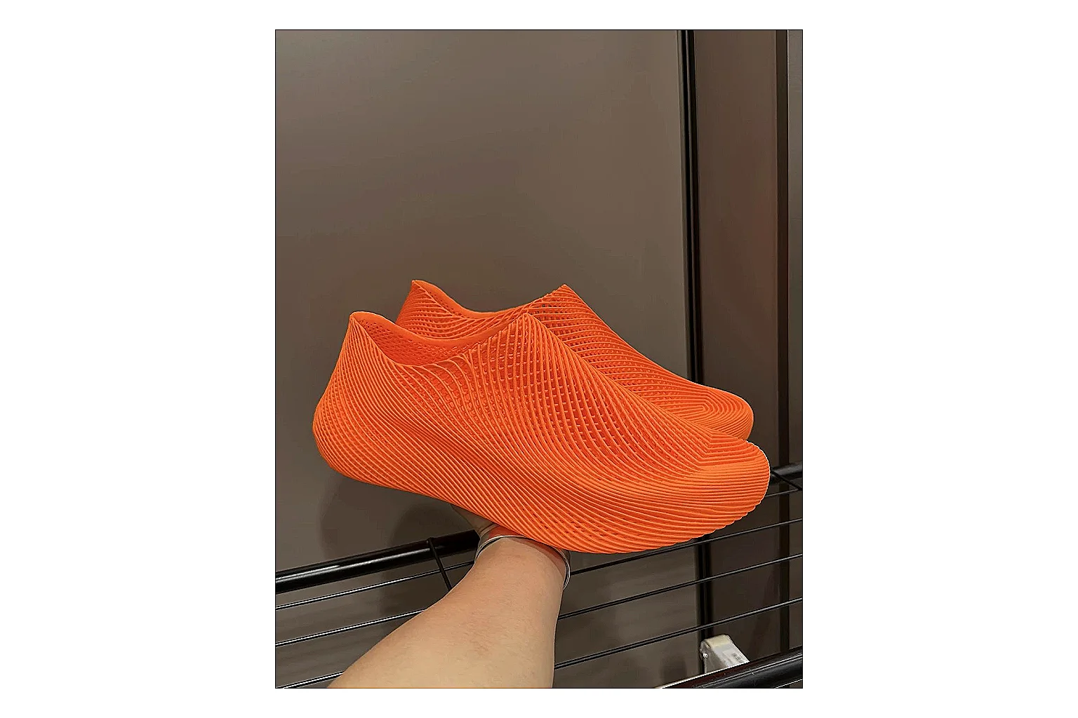 Other 4D Printed Orange Slip-On Sneakers spreadsheet record photo showing orange open-grid upper, seamless slip-on shape, sculpted sole, and futuristic lightweight profile thumbnail 6