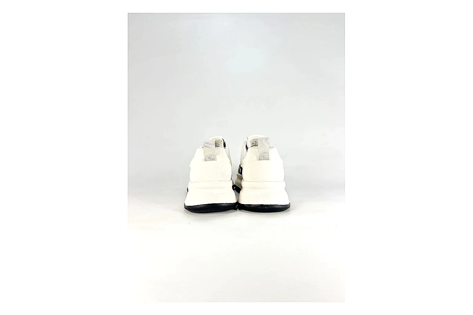 Low Runner White Black Sneaker spreadsheet record photo showing white black synthetic low-top upper, minimal runner shape, clean panels, and casual sole