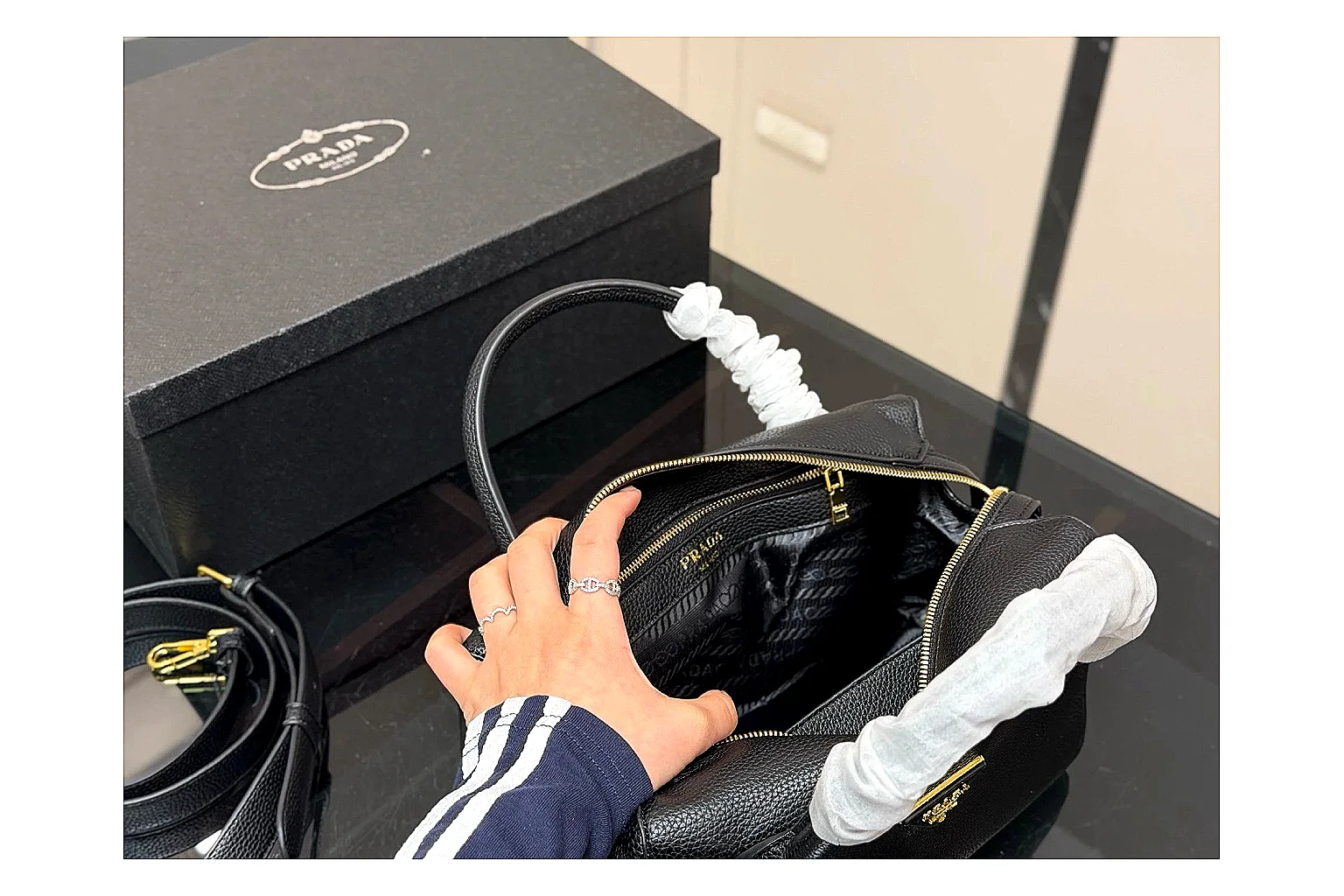 Prada Mini Top Handle Black spreadsheet record photo showing black leather mini bag body, structured top handle, compact silhouette, and clean metal hardware
