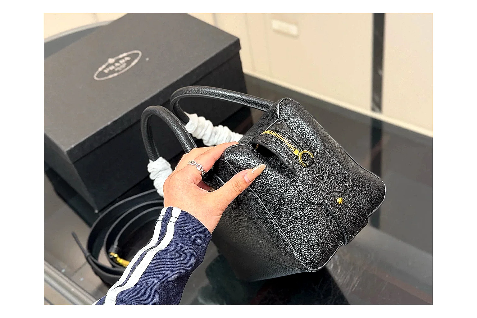 Prada Mini Top Handle Black spreadsheet record photo showing black leather mini bag body, structured top handle, compact silhouette, and clean metal hardware thumbnail 5