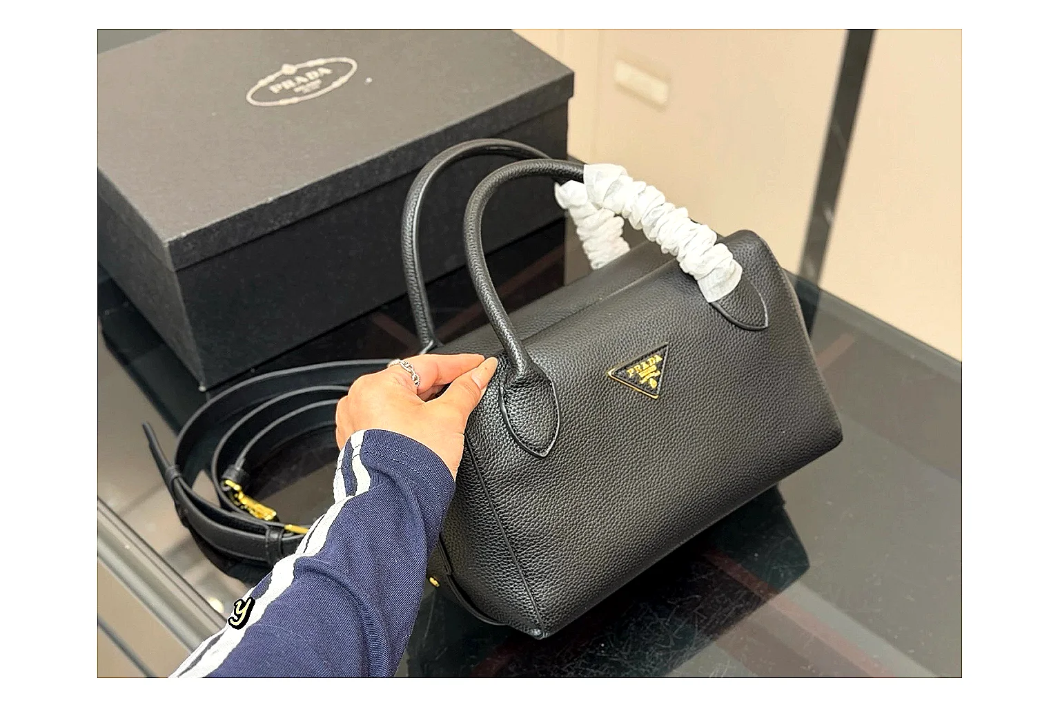 Prada Mini Top Handle Black spreadsheet record photo showing black leather mini bag body, structured top handle, compact silhouette, and clean metal hardware thumbnail 6