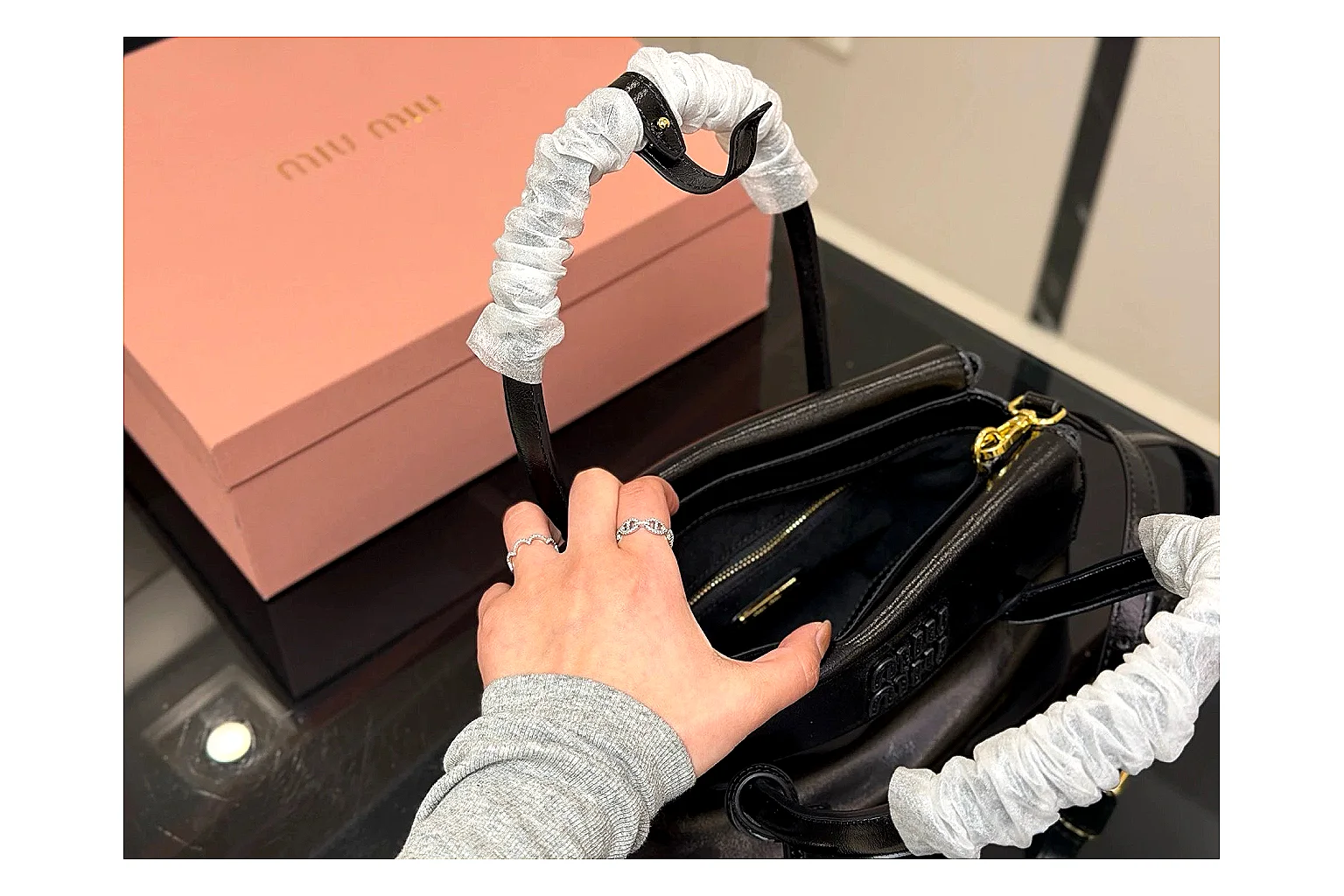 Prada Mini Top Handle Black spreadsheet record photo showing black leather mini bag body, structured top handle, compact luxury shape, and clean hardware details thumbnail 4