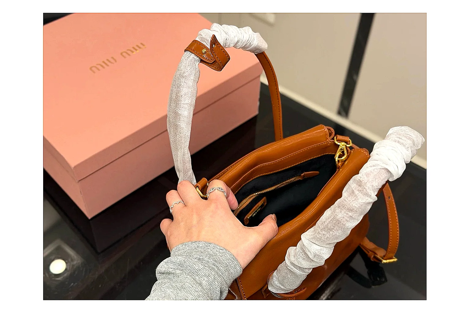 Prada Mini Top Handle Orange Brown spreadsheet record photo showing orange brown leather mini bag body, structured top handle, compact shape, and clean hardware details thumbnail 4