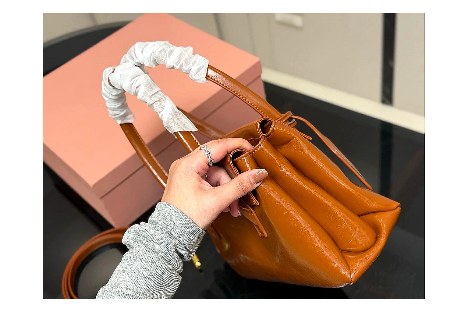 Prada Mini Top Handle Orange Brown spreadsheet record photo showing orange brown leather mini bag body, structured top handle, compact shape, and clean hardware details thumbnail 5