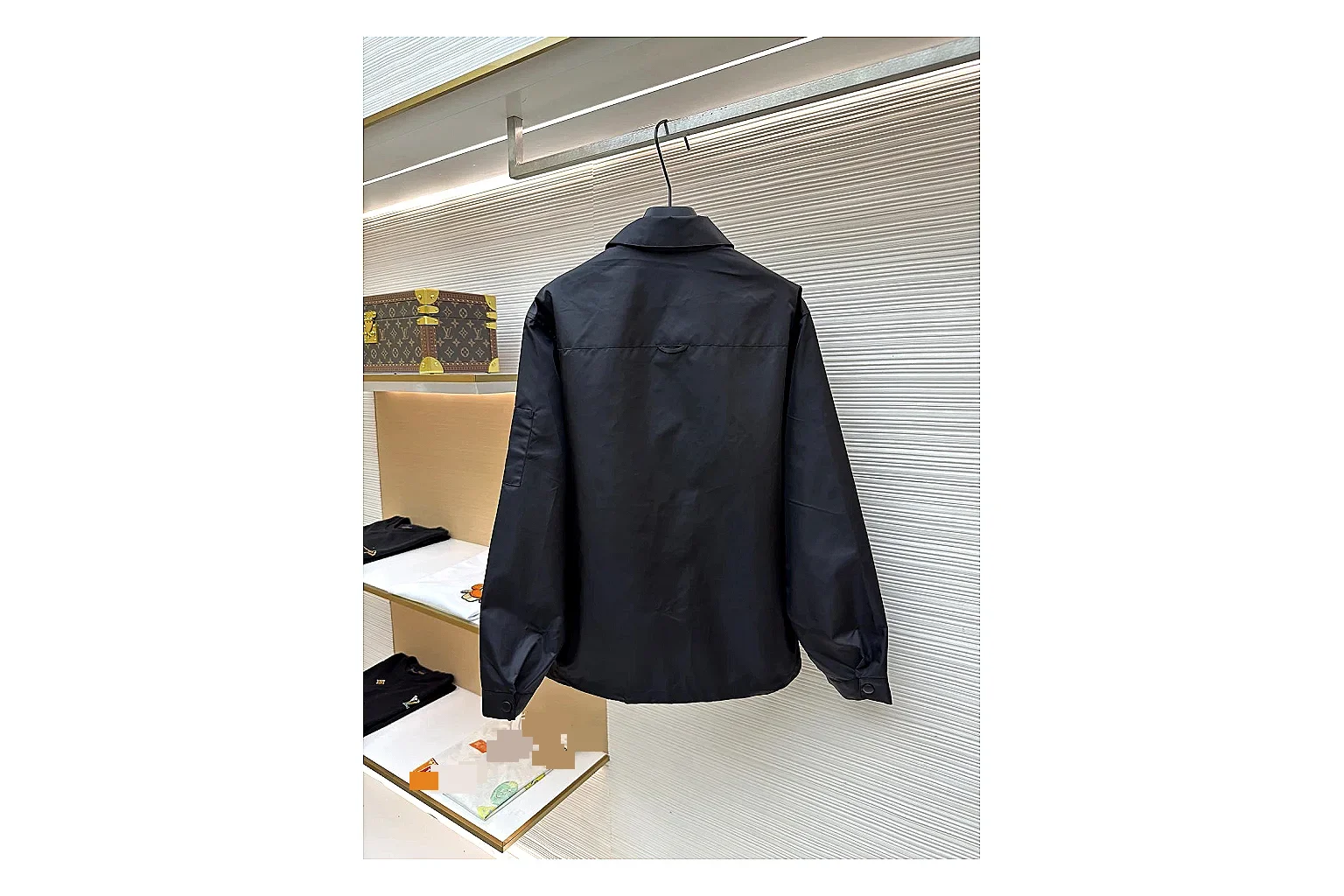 Prada Re-Nylon Hooded Jacket Black Jacket spreadsheet record image with black Re-Nylon hooded jacket with recycled-nylon texture, hood structure, zipper line, sleeve cuffs, and light shell shape