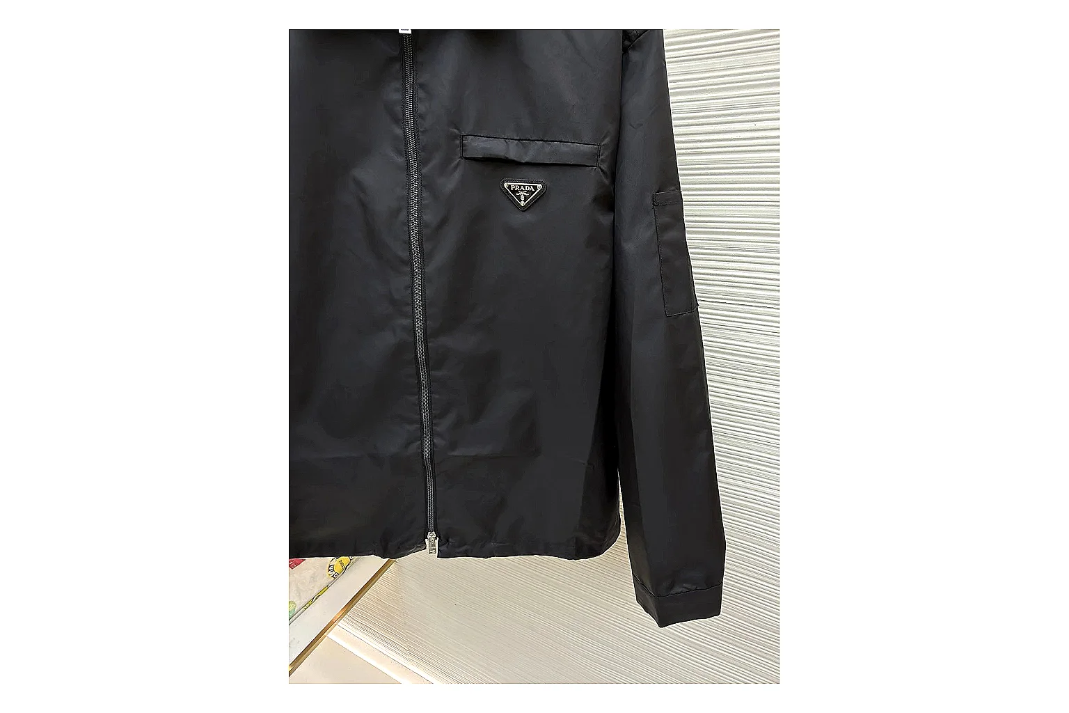 Prada Re-Nylon Hooded Jacket Black Jacket spreadsheet record image with black Re-Nylon hooded jacket with recycled-nylon texture, hood structure, zipper line, sleeve cuffs, and light shell shape thumbnail 2
