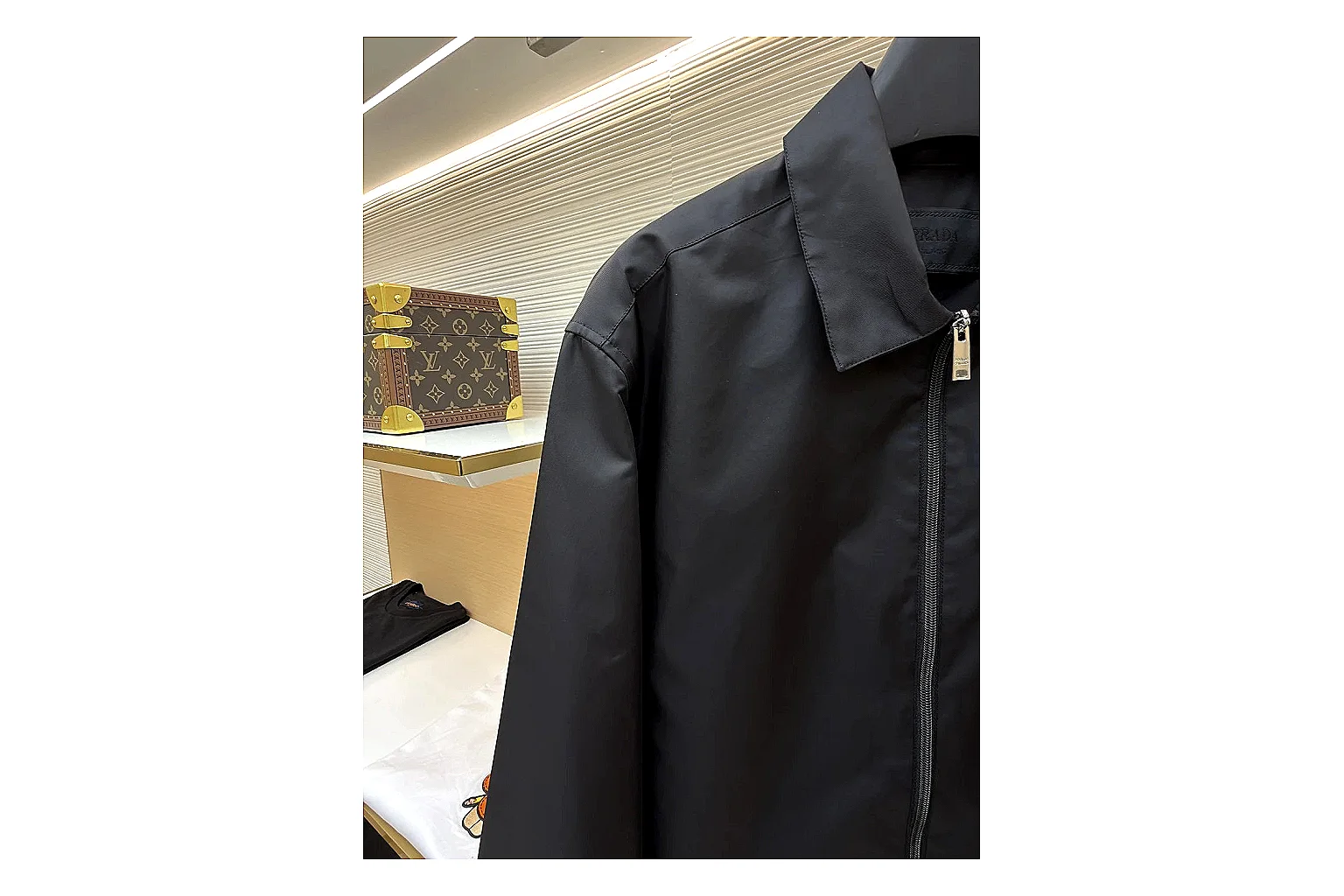 Prada Re-Nylon Hooded Jacket Black Jacket spreadsheet record image with black Re-Nylon hooded jacket with recycled-nylon texture, hood structure, zipper line, sleeve cuffs, and light shell shape thumbnail 3