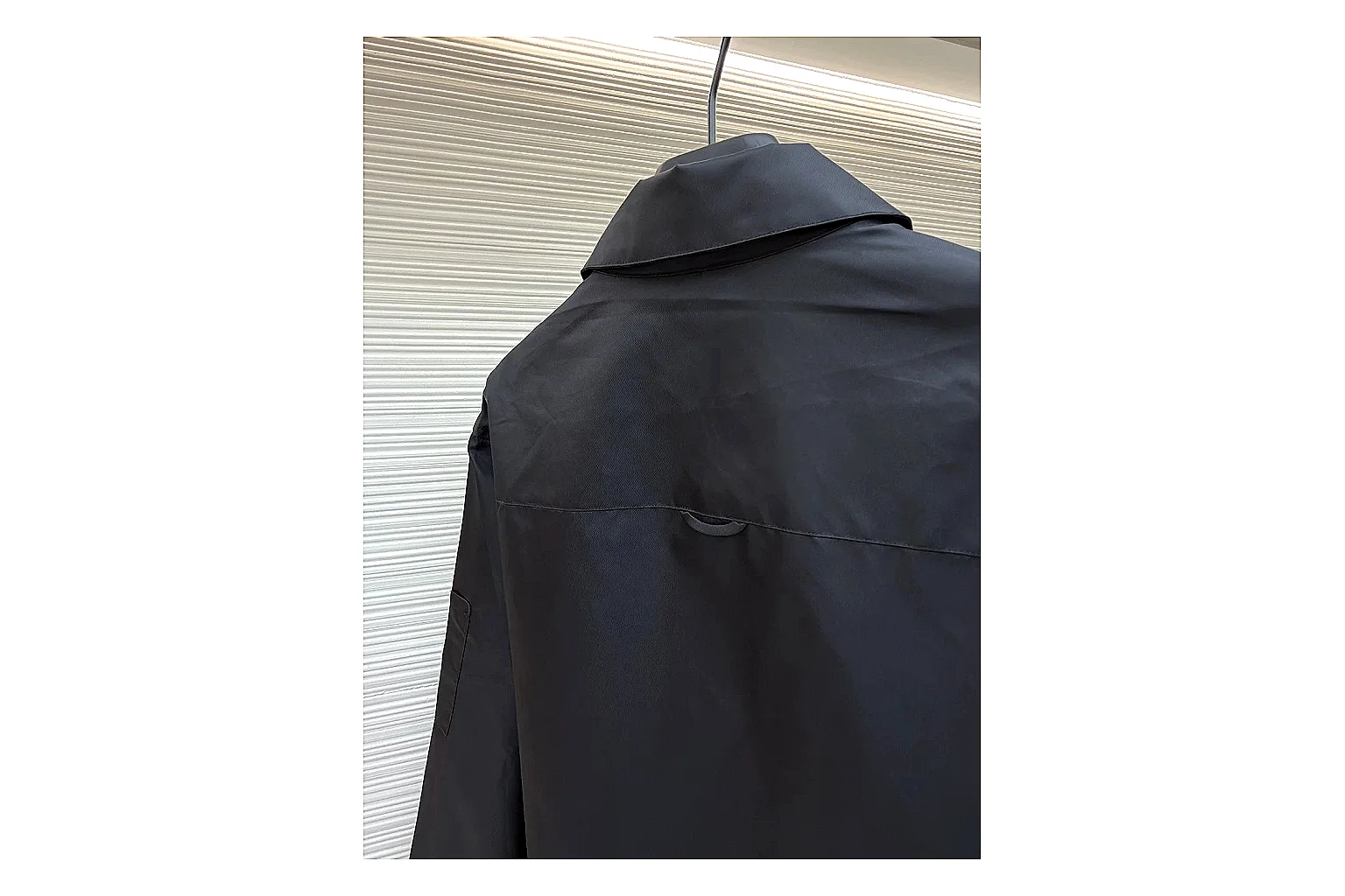 Prada Re-Nylon Hooded Jacket Black Jacket spreadsheet record image with black Re-Nylon hooded jacket with recycled-nylon texture, hood structure, zipper line, sleeve cuffs, and light shell shape