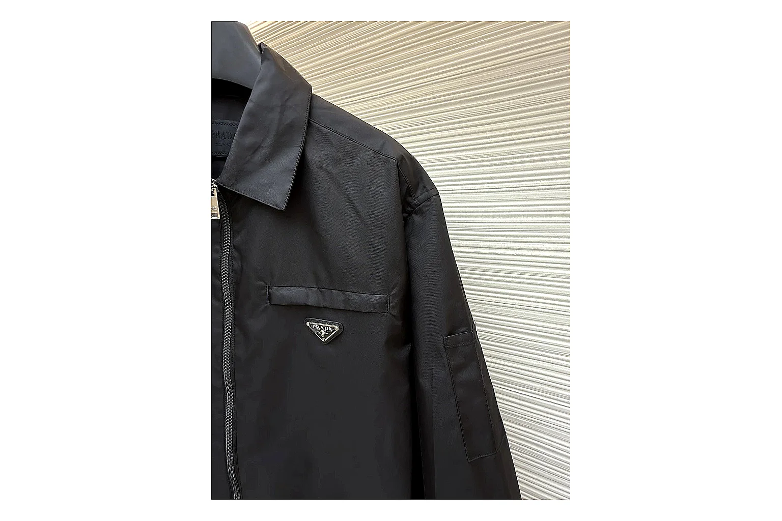 Prada Re-Nylon Hooded Jacket Black Jacket spreadsheet record image with black Re-Nylon hooded jacket with recycled-nylon texture, hood structure, zipper line, sleeve cuffs, and light shell shape thumbnail 5
