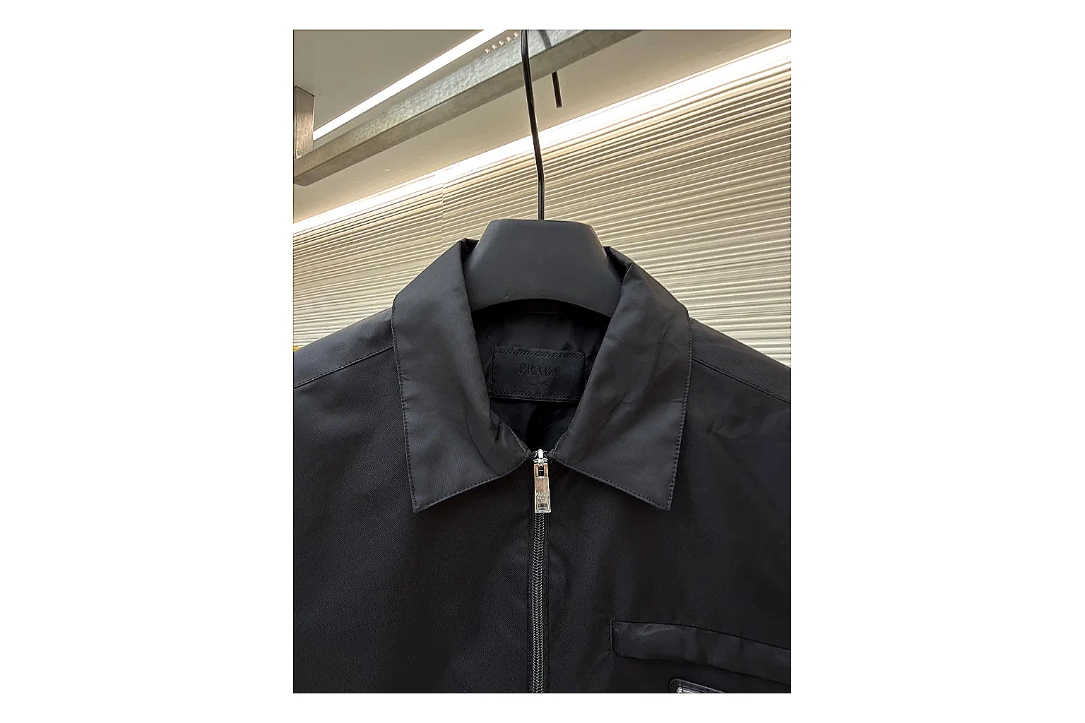 Prada Re-Nylon Hooded Jacket Black Jacket spreadsheet record image with black Re-Nylon hooded jacket with recycled-nylon texture, hood structure, zipper line, sleeve cuffs, and light shell shape thumbnail 6