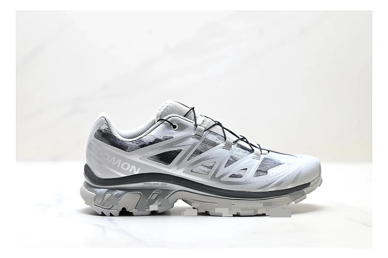 Salomon Xt Runner Silver Gray spreadsheet record photo showing silver gray mesh trail upper, technical runner overlays, speed-lace style structure, and rugged sole
